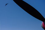 A B2 Spririt graces the skies above the P-38's propeller.